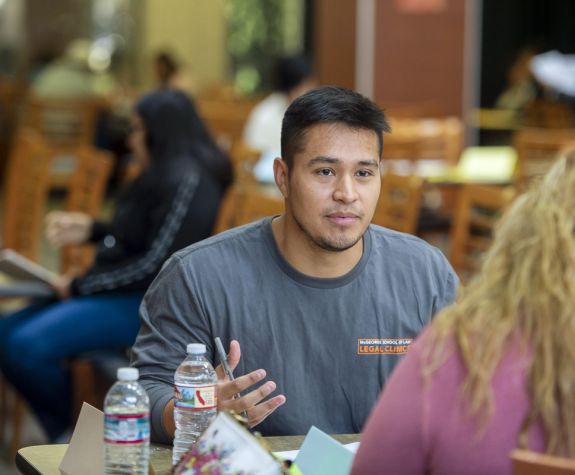 Law student advising at immigration clinic